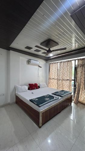 a bedroom with a large bed in a room at The MEERA in Godarpura