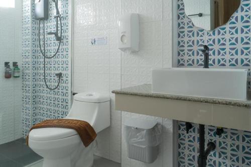 a bathroom with a toilet and a sink and a shower at Nonsi Hotel Phitsanulok in Ban Wat Tha Maprang