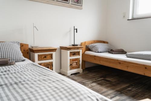 a bedroom with two beds and two night stands at Fewo 14 DG in Goch