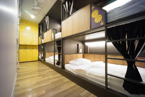 a group of bunk beds in a room at BRB Hostel Bangkok Silom in Bangkok