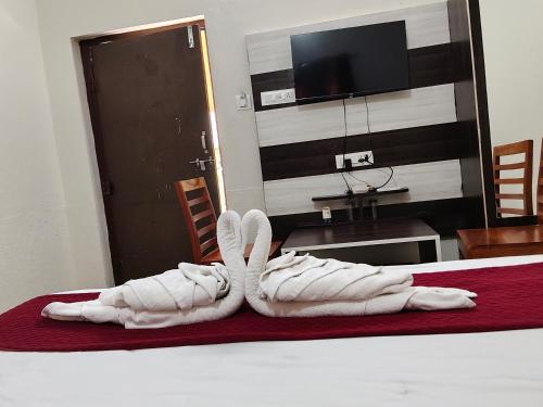 a white towel on a table in a room at L S Haveli - A Heritage Lake View Haveli in Pushkar