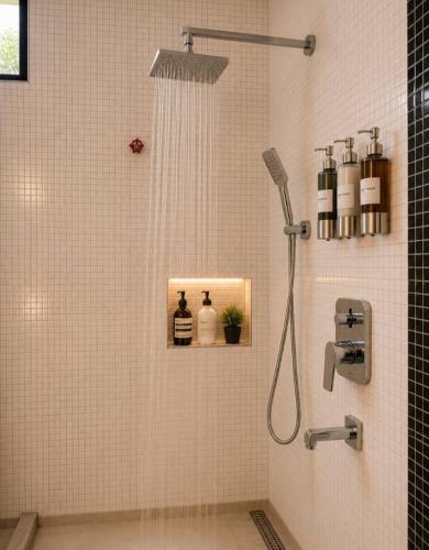 a shower in a bathroom with a shower at The Serenity Hideaway in Arusha