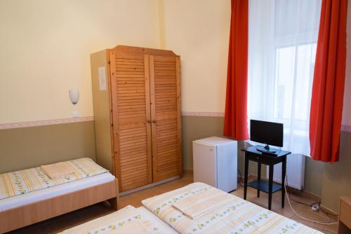 Postel nebo postele na pokoji v ubytování Taverna panzió