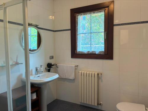 a bathroom with a sink and a window at Balentzenea Rural House in Lesaka