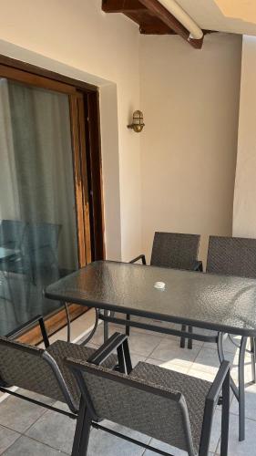 a black table and chairs in a room at Panorama in Menídion