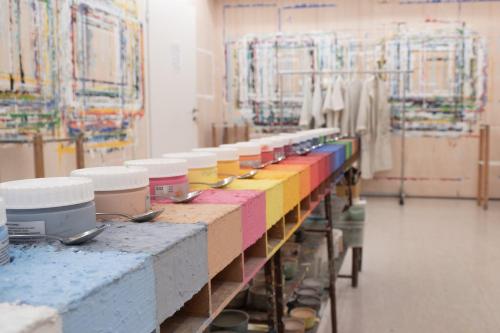a long table with many different colored containers on it at Seminar-Hotel Rigi am See in Weggis