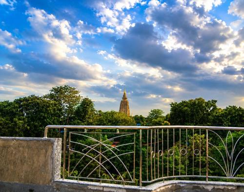 a view of a building in the distance with trees at Shahi House in Bodh Gaya