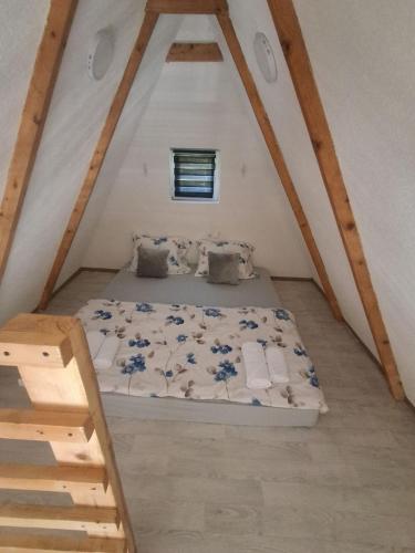 a bedroom with a bed in a attic at Lajlas home in Orašac