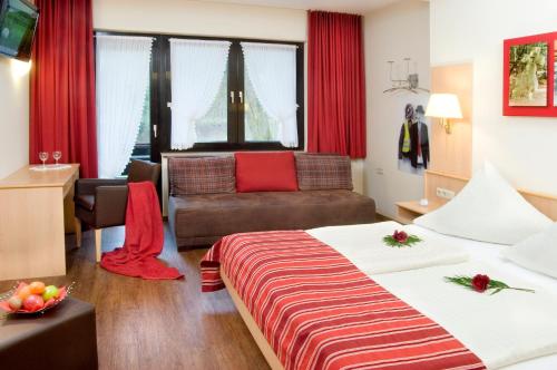 Postel nebo postele na pokoji v ubytování Hotel Hauer