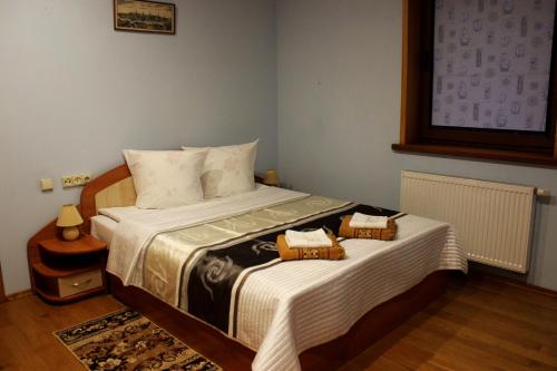 Lova arba lovos apgyvendinimo įstaigoje Vidų Guest House