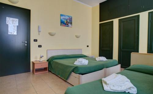 Posteľ alebo postele v izbe v ubytovaní Soggiorno Marino San Giuseppe