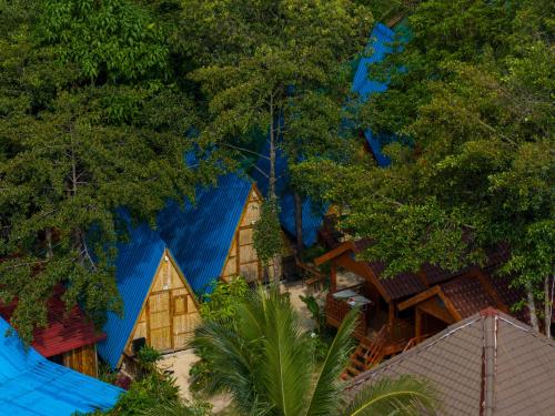 an aerial view of a resort with blue roofs and trees at Europe Enchanted Resort in Kaôh Rŭng (3)