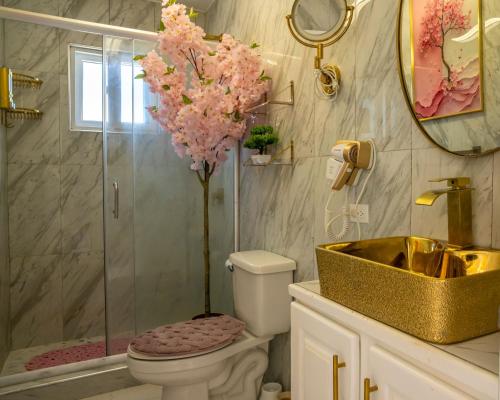 a bathroom with a shower and a toilet and a sink at Bselifestyle in Green Island