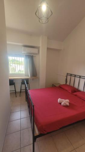 a bedroom with a red bed with a red blanket at B&B Aut in Fiore in Ravenna
