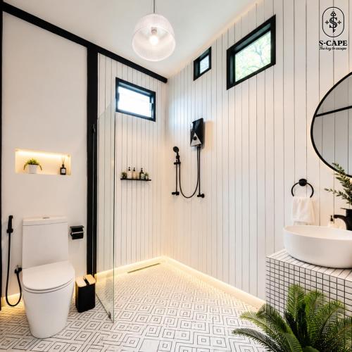 a bathroom with a toilet and a sink at S-Cape at Rim Khwae in Ban Tha Thong Mon