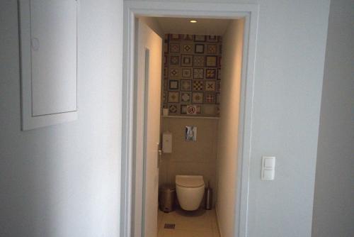 a bathroom with a toilet in a hallway at Ocean Dreams in Palaiochora