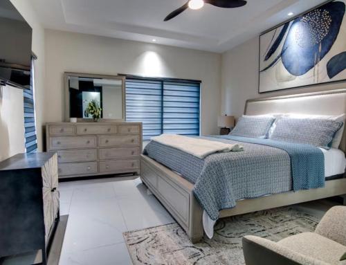 a bedroom with a large bed and a dresser at The St Ann Haven in Seville