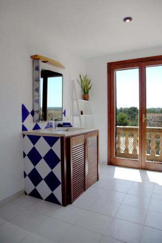 a bathroom with a sink and a mirror at Cas Coco – 8-Person Townhouse near Playa de Muro ⭐ in Muro