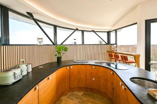 a kitchen with a sink and a counter top at Martello 25 in Dymchurch