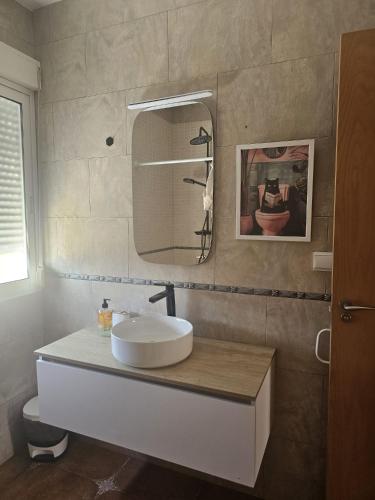 a bathroom with a sink and a mirror at Miradol del Sol in La Nucía