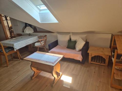 a living room with a couch and a table at Appartment Haus Zirknitz in Mitterzirknitz