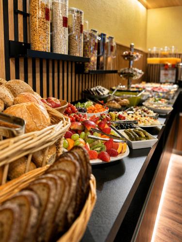 a buffet line with many different types of food at Maiers Hotel in Bayerisch Eisenstein