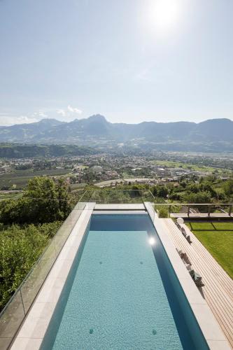 a swimming pool in a villa with a view at Residence Aqualis in Marlengo