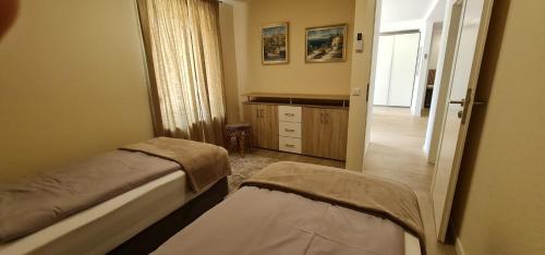a bedroom with a bed and a door to a hallway at Hotel Rebstock in Baden-Baden
