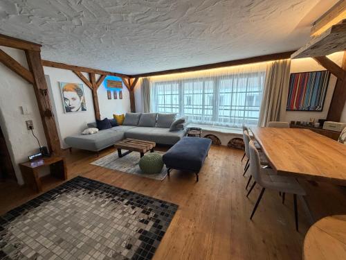 a living room with a couch and a table at Appartement Schönpflug in Kaprun