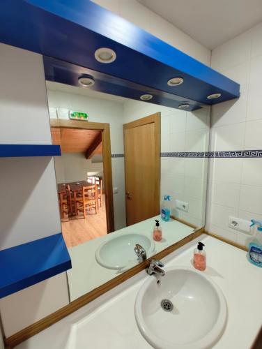 a bathroom with a sink and a mirror at La Bodega Del Camino in Lorca