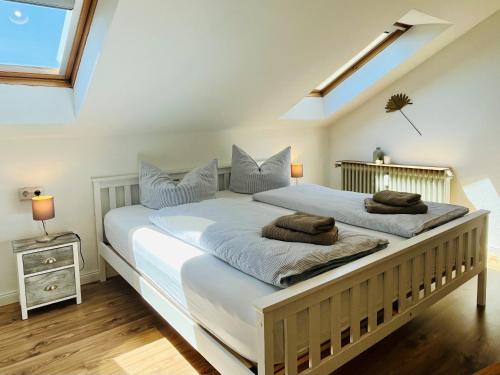 a bedroom with two beds with pillows on them at See Apart 7 in Öhningen