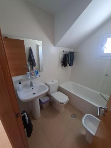 a bathroom with a sink and a toilet and a tub at Condado de Alhama N478 in Alhama de Murcia
