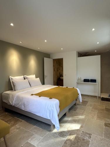 a bedroom with a large bed in a room at Des Ciappes et des Fées in Menton