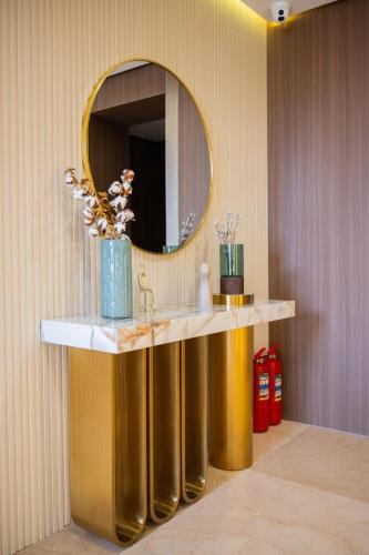 a bathroom with a sink and a mirror at Ustyurt boutique hotel in Aktau
