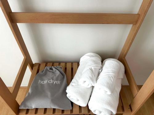 a pair of white socks and a bag on a shelf at April Ari-Saphankhwai in Bangkok