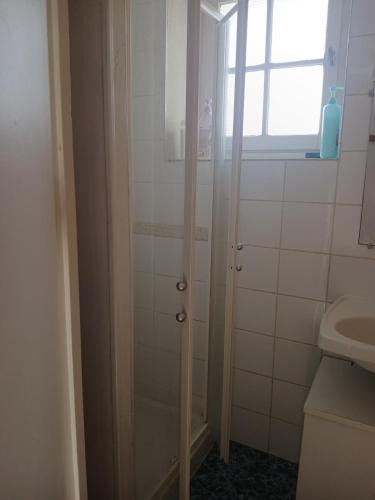 a bathroom with a shower and a sink at Maison proche château in Bressuire