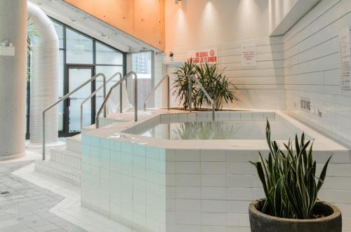 a hot tub in a building with plants at InterContinental Toronto Centre by IHG in Toronto