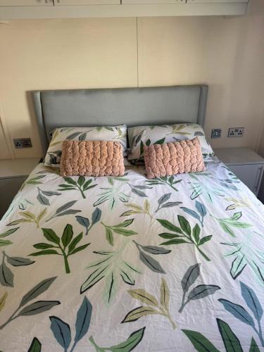 a bed with two pillows on top of it at Static 34 Newton Abbott Devon TQ126JR in Bickington