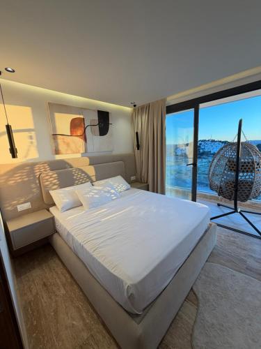 a bedroom with a large bed and a large window at Triple Tower 23eme étage La vue 329 gare tgv & plage 3min in Tangier