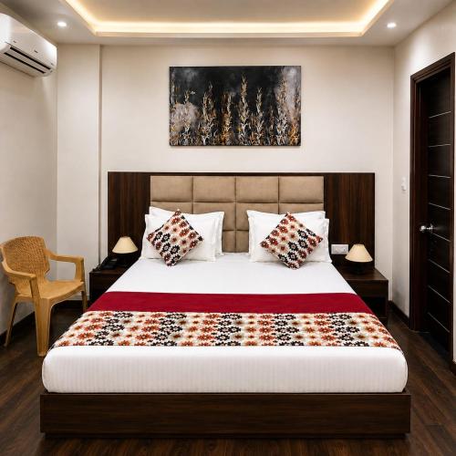 a bedroom with a bed and a painting on the wall at Narayan Palace- Luxury Homestay in Varanasi