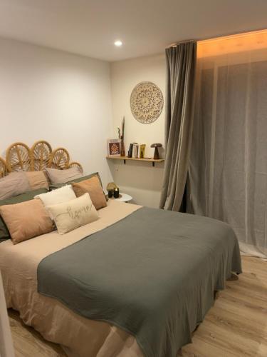 a bedroom with a large bed and a window at À Casarella di Lisa in Vescovato