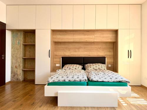 a bedroom with a large white bed in a room at Apartmán Palza Jablonec in Jablonec nad Nisou