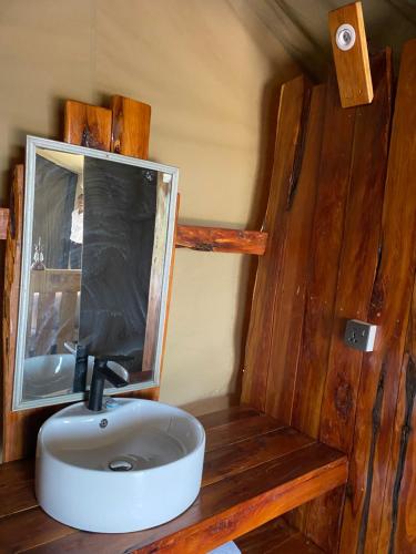 a bathroom with a sink and a mirror at Oloibormut in Sekenani