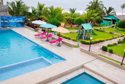 an image of a swimming pool at a resort at Nima Resort et Suites in Mandanou