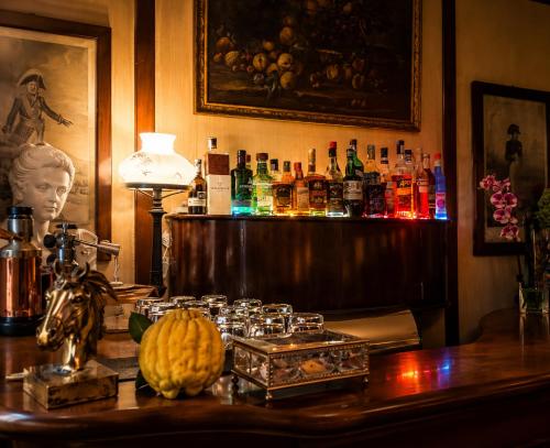 a bar with a pumpkin on a wooden table at Resort Dei Limoni Tower Inn in Lucca