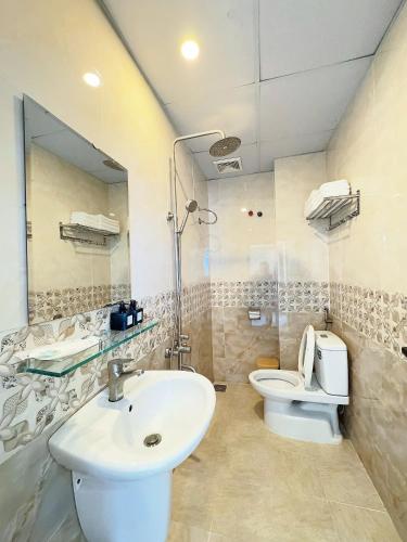 a bathroom with a sink and a toilet at Dalat Mist House - Đà Lạt in Da Lat