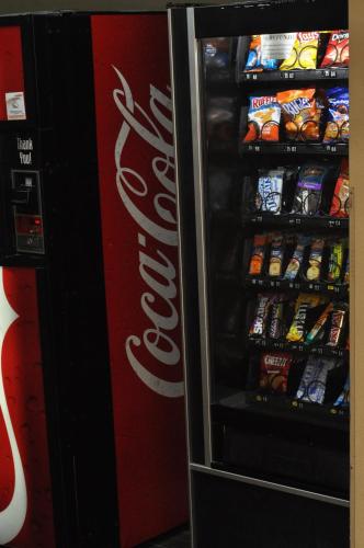 a cocacola soda vending machine in a store at Microtel Inn & Suites by Wyndham Lithonia/Stone Mountain in Lithonia