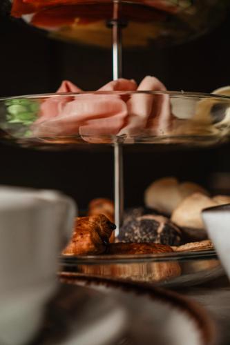 a plate of food on a shelf with food at Le Consulat in Lisbon