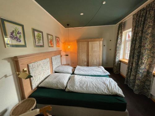 a bedroom with two beds in a room at Prinzenvilla in Berge