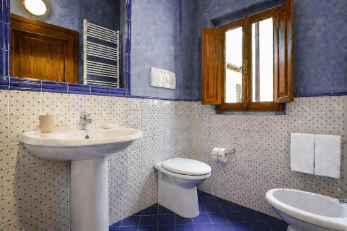 a bathroom with a sink and a toilet at Accademia Residence in Prato